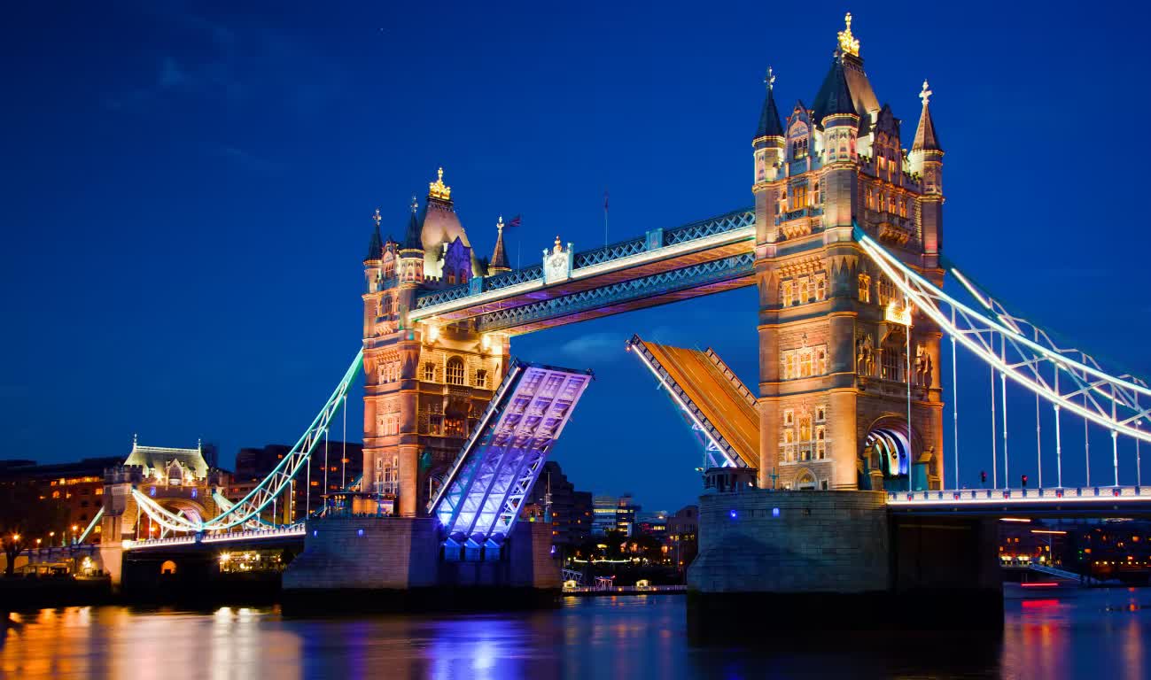Tower Bridge illuminated at night over the River Thames in London