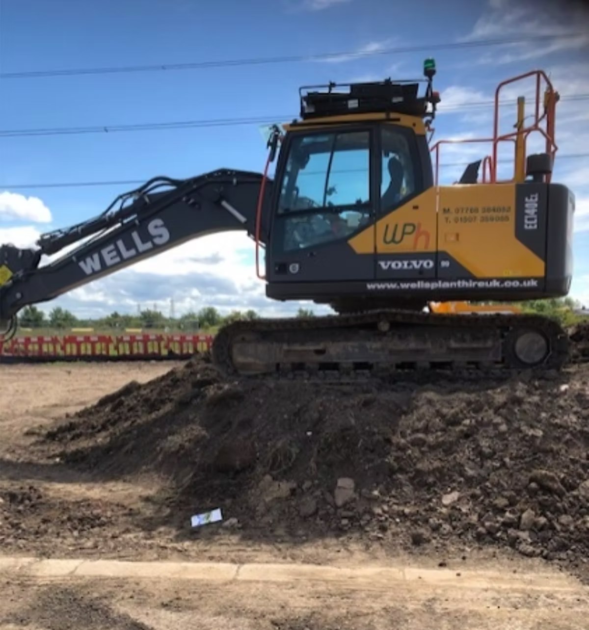 Excavator carrying out bulk excavation on a remediation site